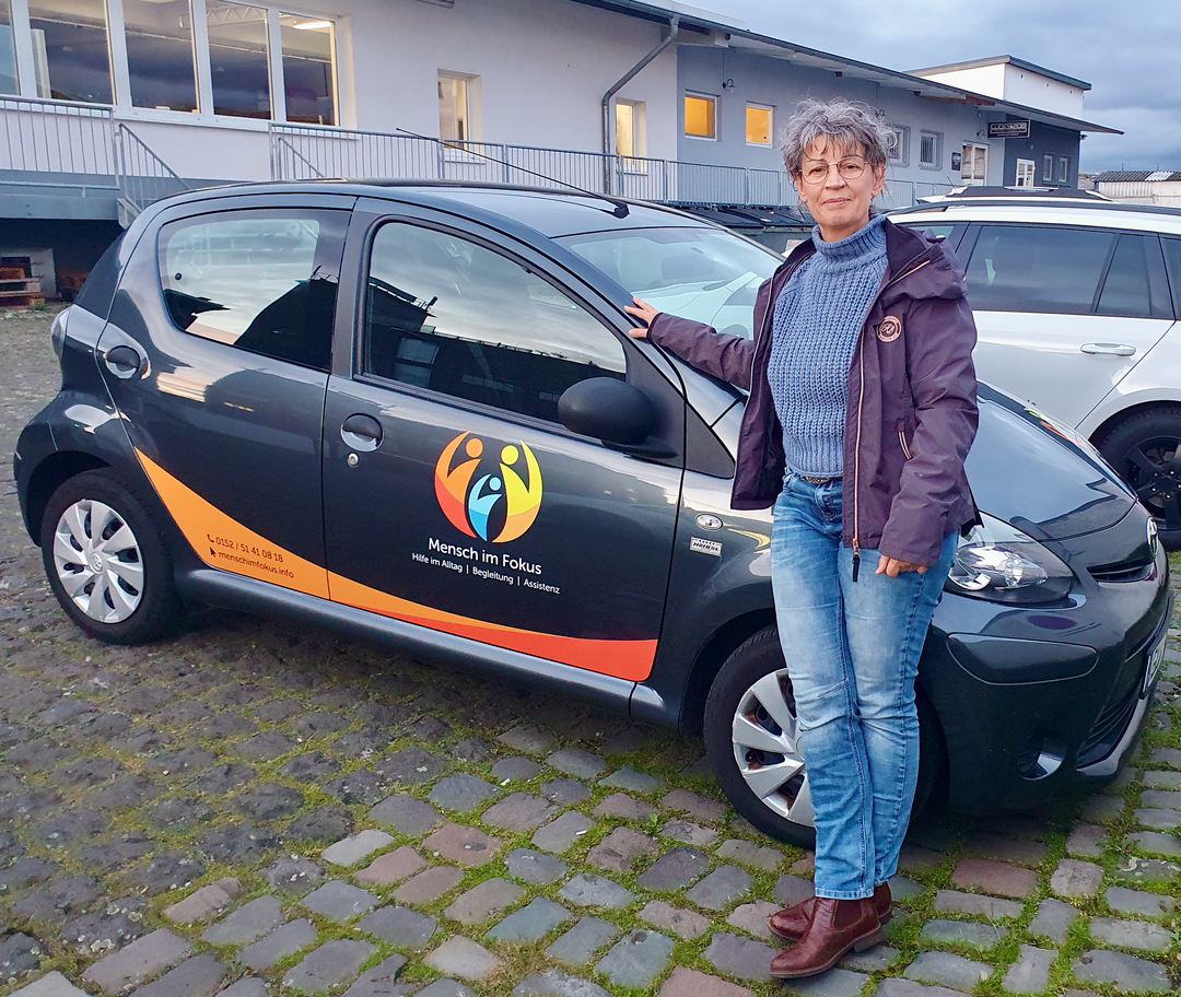 Logo: Mensch im Fokus